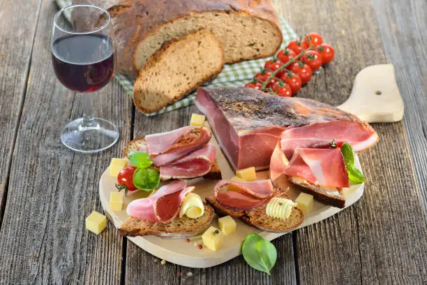 South Tyrolean bacon snack with fresh stone oven baked bread and mountain cheese