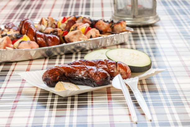 Grilling sausages on barbecue grill. Selective focus.