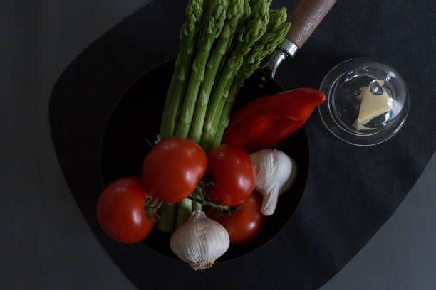 red and green vegetables decorated table with grey and black background