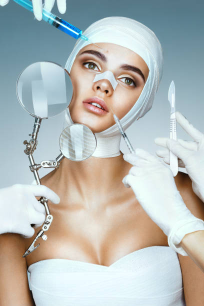 istock Many hands holding medical instruments near face patient 680177034