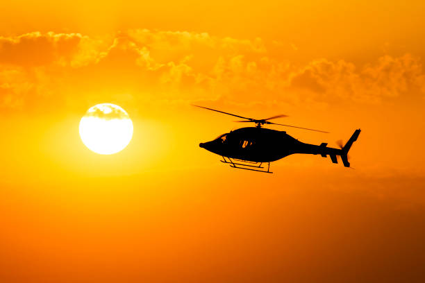 istock Helicopter silhouette across the sun 680177276