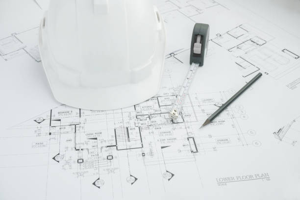 istock Architects workplace - architectural tools, blueprints, helmet, measuring tape, Construction concept. Engineering tools. Top view 680178592