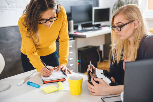 istock Two business woman working together at the office 680185698