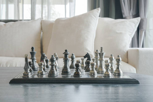 istock Brass chess on table with white sofa set in living room 680191540