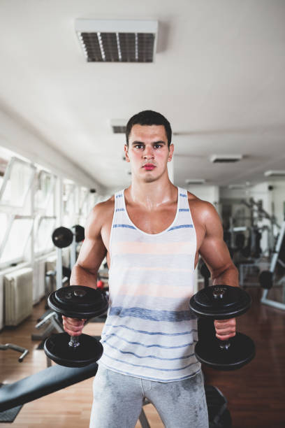 istock Attractive young man in gym 680194434