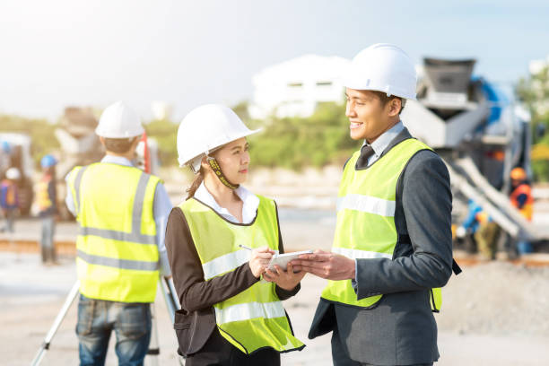 istock Happy Engineer and secretary discussing about new construction project 680200482