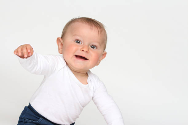 istock Baby stretches out arm 680213950