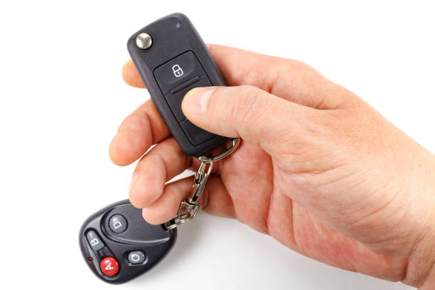 istock Man presses button on the ignition key on a white background 680214214