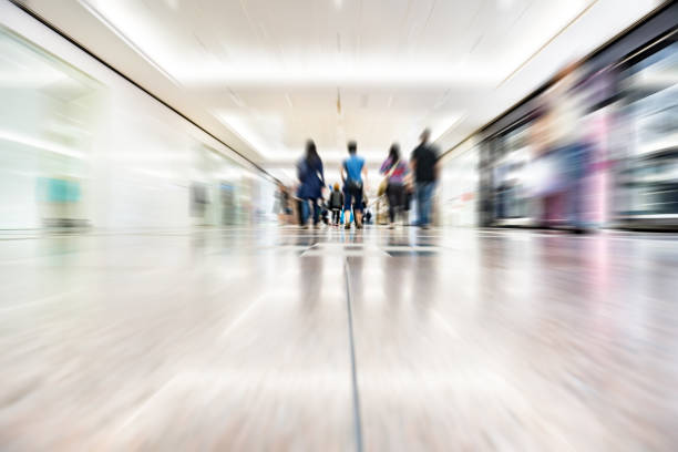 istock Blurred customers walking in shopping mall, Hong Kong 680220760