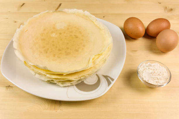istock Crepes on wooden background - top view 680225612