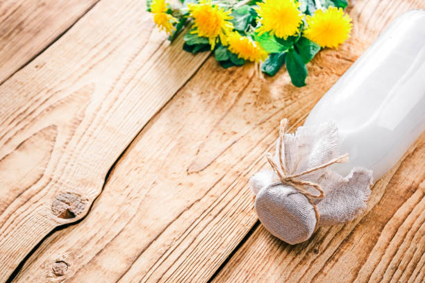 istock Milk bottle and dandelions 680227880