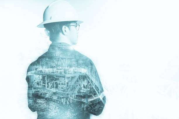 istock Double exposure of Engineer or Technician man with safety helmet operated platform or plant by using tablet with offshore oil and gas platform background for oil and gas business concept. 680227992