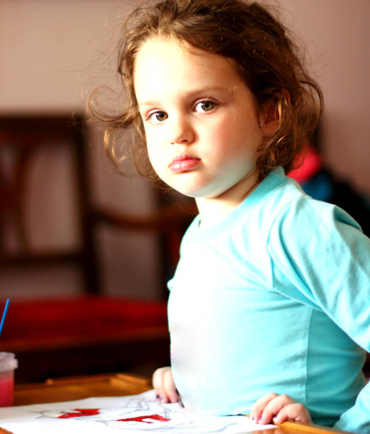 istock Beautiful young girl drawing 680235322