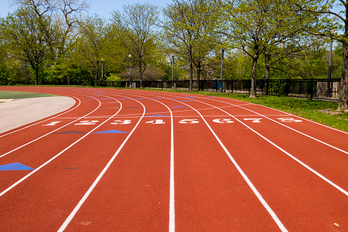 A shot of a finish line at an oval running track.
