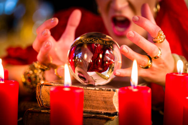 istock Soothsayer during session with Crystal ball 680251880