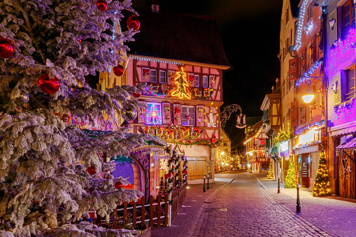 Traditional old half-timbered houses in the historic city of Colmar. Decorated and lighted during the Christmas season. Alsace. France.