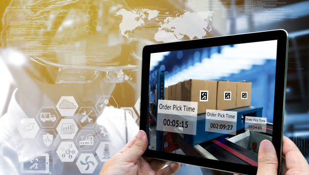 istock Industry 4.0,Augmented reality and smart logistic concept. Hand holding tablet with AR application for check order pick time in smart factory warehouse.Man use AR glasses and infographic background. 680262138