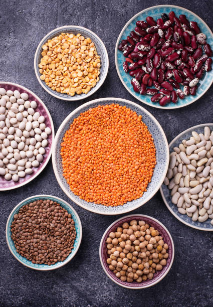 istock Various legumes. Chickpeas, red lentils, black lentils, yellow peas and beans 680265440