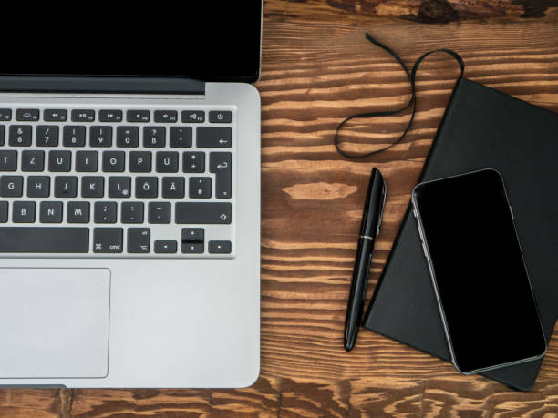 istock Wooden Desk with Laptop, notebook and smartphone. Top-view 680273876