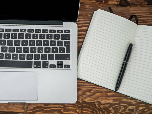 istock Wooden Desk with Laptop, notebook and smartphone. Top-view 680273932