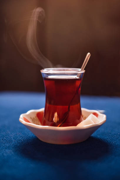 istock Traditional turkish drink of tea on blue table 680275254