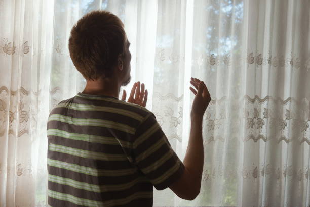 istock Muslim man at dua contritely praying indoor at light beam window 680276048
