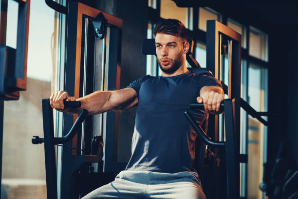 istock Handsome man in the gym doing chest exercise 680283774
