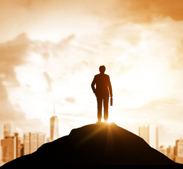 istock Businessman looking at orange city from hill 680286672