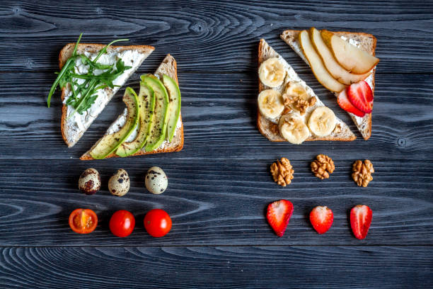 istock lunch with triangle sandwiches on dark table background top view 680287658