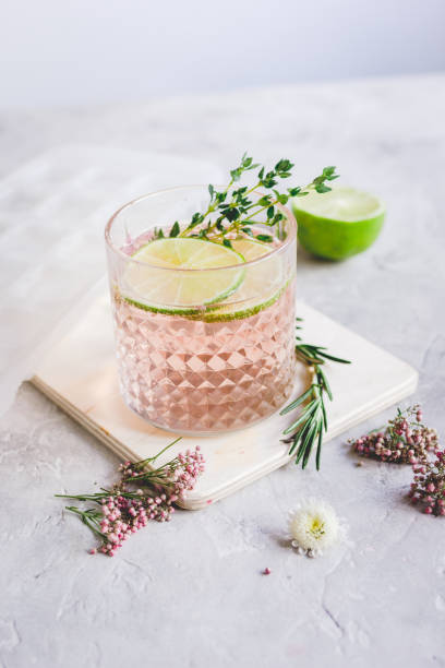 istock fresh homemade drink with flowers and lime on kitchen background 680287694
