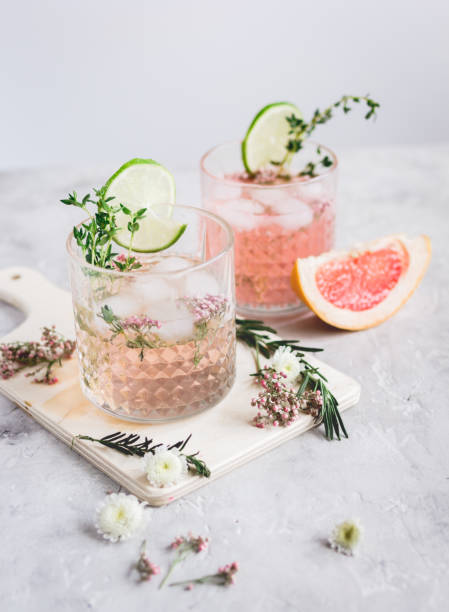 istock summer homemade juice with lime and blossom on stone table background 680287702