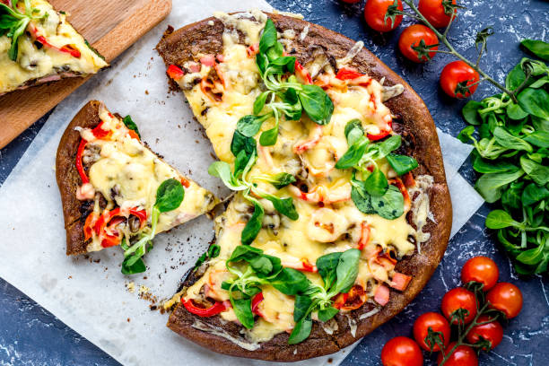 istock cooking pizza with vegetables and cheese on stone desk background top view 680288010