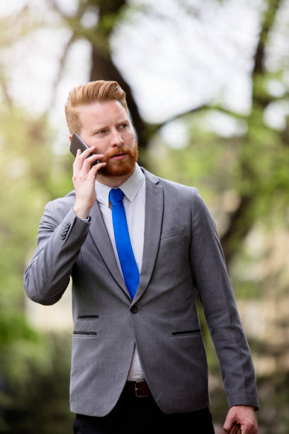 istock Young businessman talking on his smartphone in the park 680294872