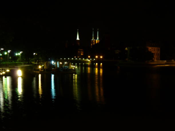 istock Wroclaw at night. Beautifully lit buildings reflecting in the Odra river. 680297632