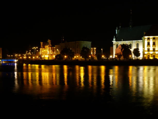 istock Wroclaw at night. Beautifully lit buildings reflecting in the Odra river. 680297670