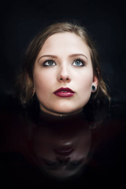 istock Beautiful Woman In Black Water 680303264