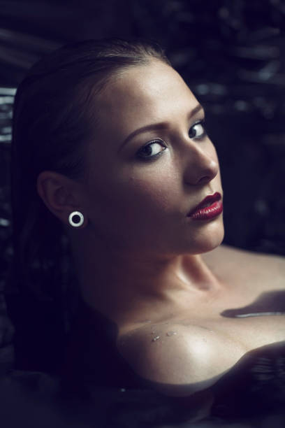 istock Beautiful Woman In Black Water 680303328
