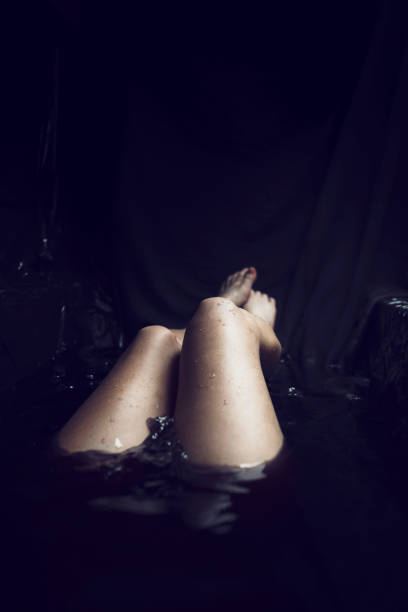 istock Beautiful Woman In Black Water 680303330