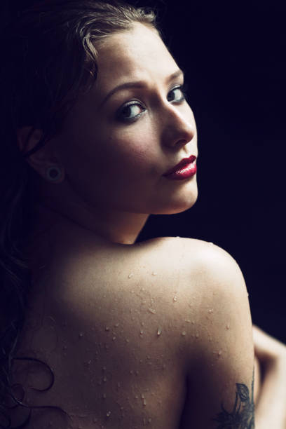 istock Beautiful Woman In Black Water 680303344