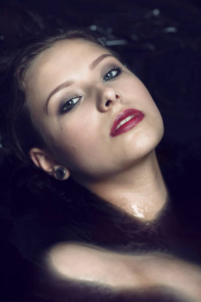 istock Beautiful Woman In Black Water 680303354