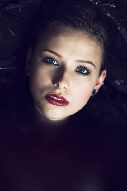 istock Beautiful Woman In Black Water 680303360