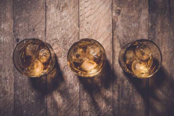 istock Whiskey glasses on an old wooden table 680303604
