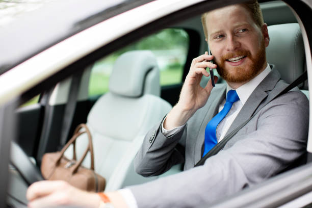 istock Businessman having call in the car 680303630
