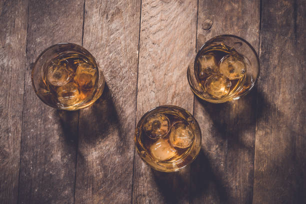 istock Whiskey glasses on an old wooden table 680303760