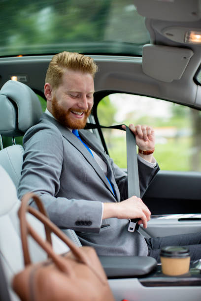 istock Young businessman entering the car 680304392