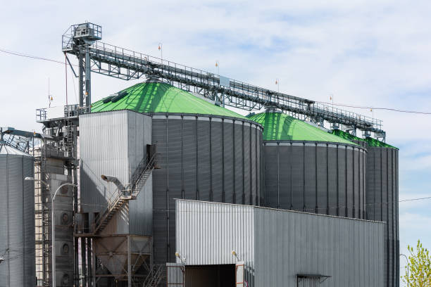 istock Grain elevator in agricultural zone. Granary with mechanical equipment for receiving, cleaning, drying, grain shipment. 680304432
