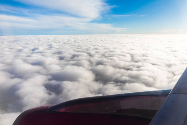 Above the clouds in the sky. View from the airplane window.