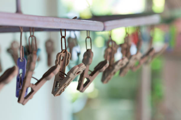 istock Clothes pegs or clothespins hang on a cord 680312356