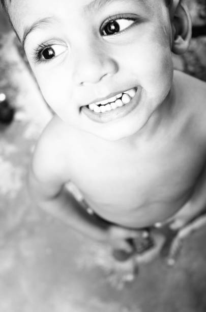 Child Bathing in a Bathtub