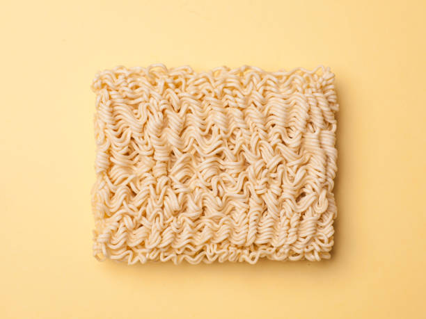 istock instant noodle ramen isolated on yellow background 680323294